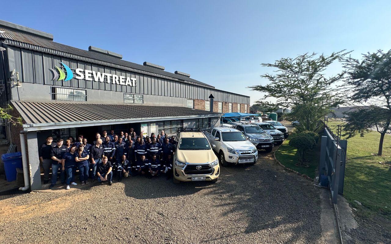 The engineering and manufacturing team outside the facility