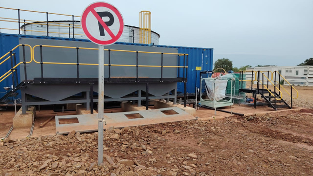 Kurmuk case-study photograph: external plant equipment and container