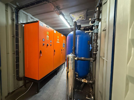 Kurmuk case-study photograph: control panels and filtration vessel