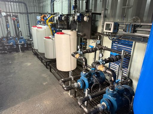 Kurmuk case-study photograph: treatment equipment and dosing tanks